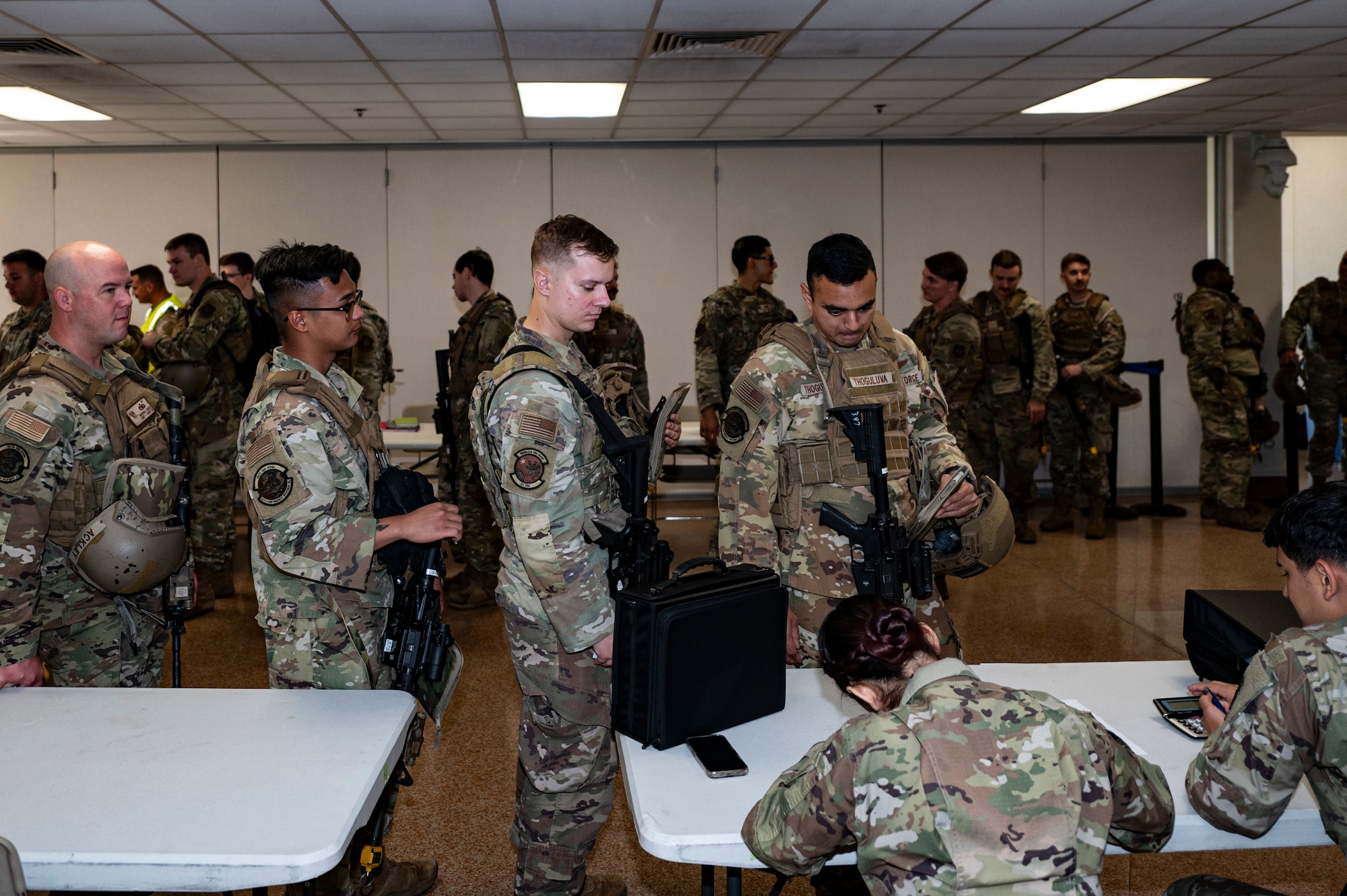 U.S. Air Force Airmen process through simulated personnel deployment functions during exercise Jersey Dawn 25 at Joint Base McGuire-Dix-Lakehurst, N.J., June 30, 2025.