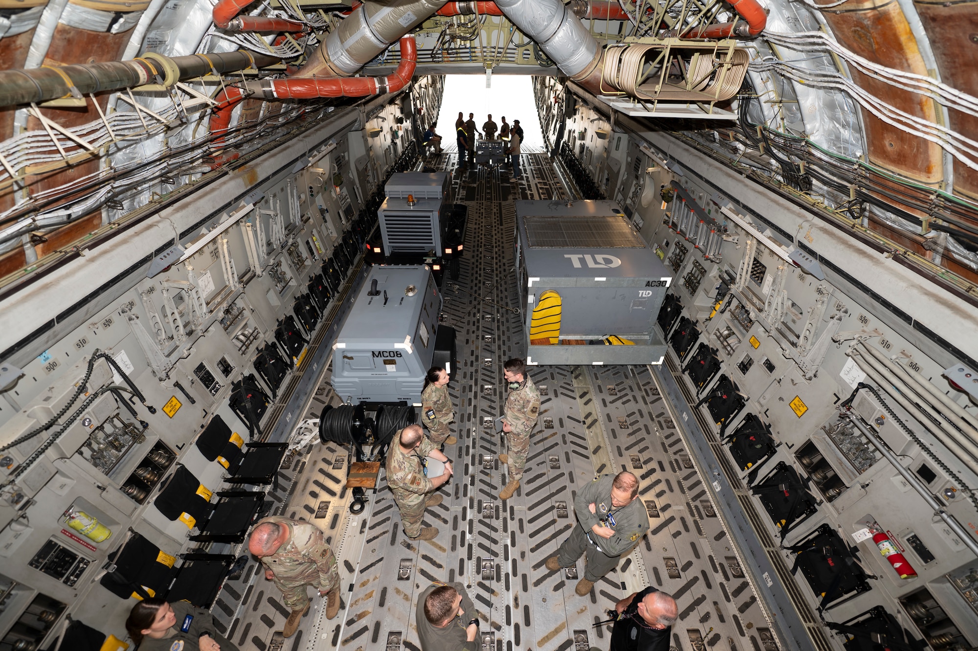 Rolling stock is locked into place on a U.S. Air Force C-17 Globemaster III for a simulated cargo deployment function during exercise Jersey Dawn 25 at Joint Base McGuire-Dix-Lakehurst, N.J. July 2, 2025.