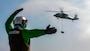 Airman Derek Jones, assigned to Helicopter Sea Combat Squadron (HSC) 9, signals a Carrier Air Wing 8 MH-60S Sea Hawk to the flight deck of the world's largest aircraft carrier, USS Gerald R. Ford (CVN 78), June 27, 2025. Gerald R. Ford, a first-in-class aircraft carrier and deployed flagship of Carrier Strike Group Twelve, incorporates modern technology, innovative shipbuilding designs, and best practices from legacy aircraft carriers to increase the U.S. Navy's capacity to underpin American security and economic prosperity, deter adversaries, and project power on a global scale through sustained operations at sea. (U.S. Navy photo by Mass Communication Specialist 2nd Class Tajh Payne)