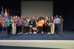 Group pose for picture after an event.