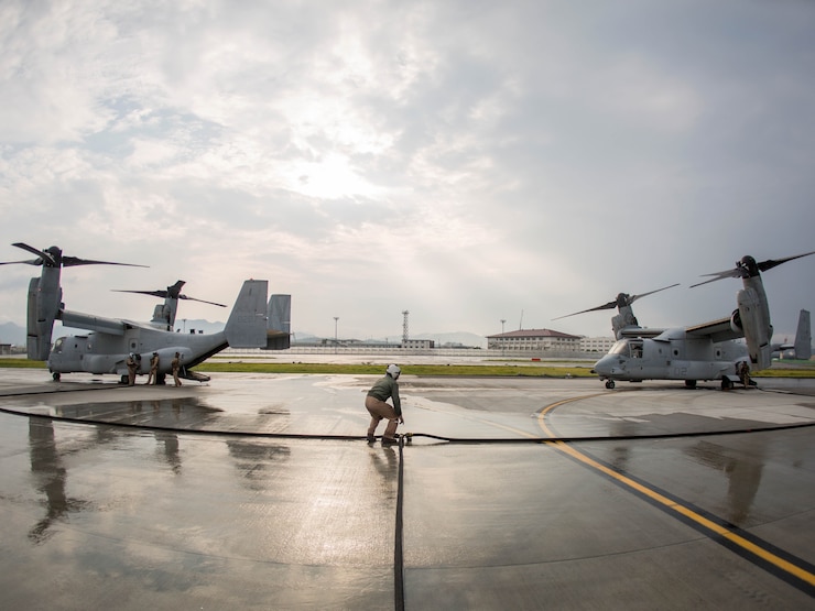 Marines with Marine Aerial Refueler Transport Squadron (VMGR) 152 MV-22B Osprey tiltrotor aircrafts with Marine Medium Tiltrotor Squadron 262 during air delivery ground refueling training aboard Marine Corps Air Station Iwakuni, Japan, Aug. 21, 2015. The KC-130J aircraft is capable of carrying more than 12,000 gallons of fuel and simultaneously refueling two aircraft at 300 gallons a minute. This ability, along with many others, makes VMGR-152 and their aircraft an important asset to Marine Corps’ aviation.