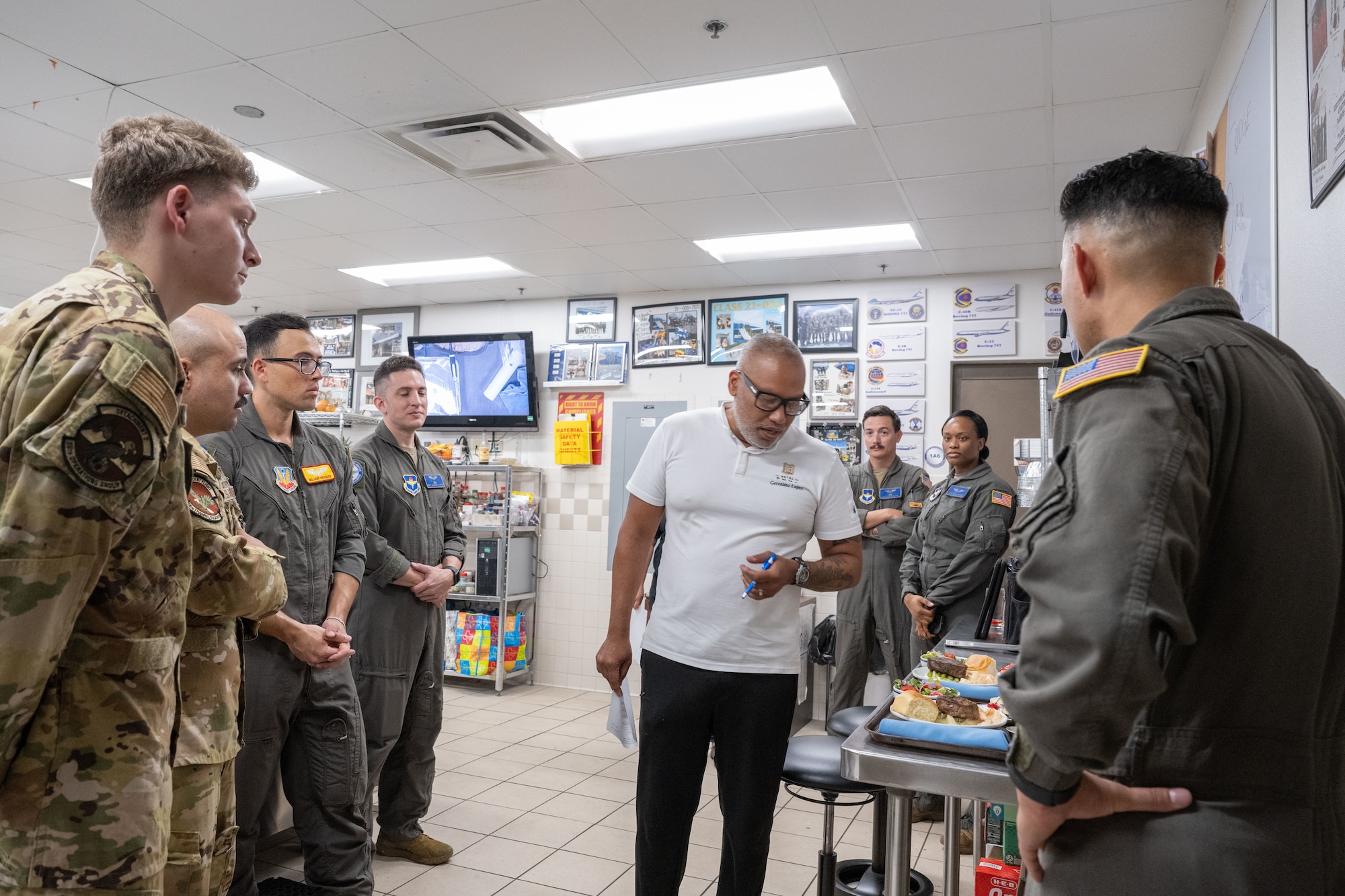 Executive chef Geronimo Lopez of Hotel Emma gestures as he talks to students from the Executive Mission Aviator course