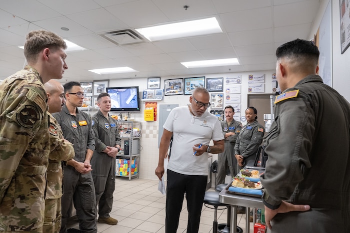 Executive chef Geronimo Lopez of Hotel Emma gestures as he talks to students from the Executive Mission Aviator course