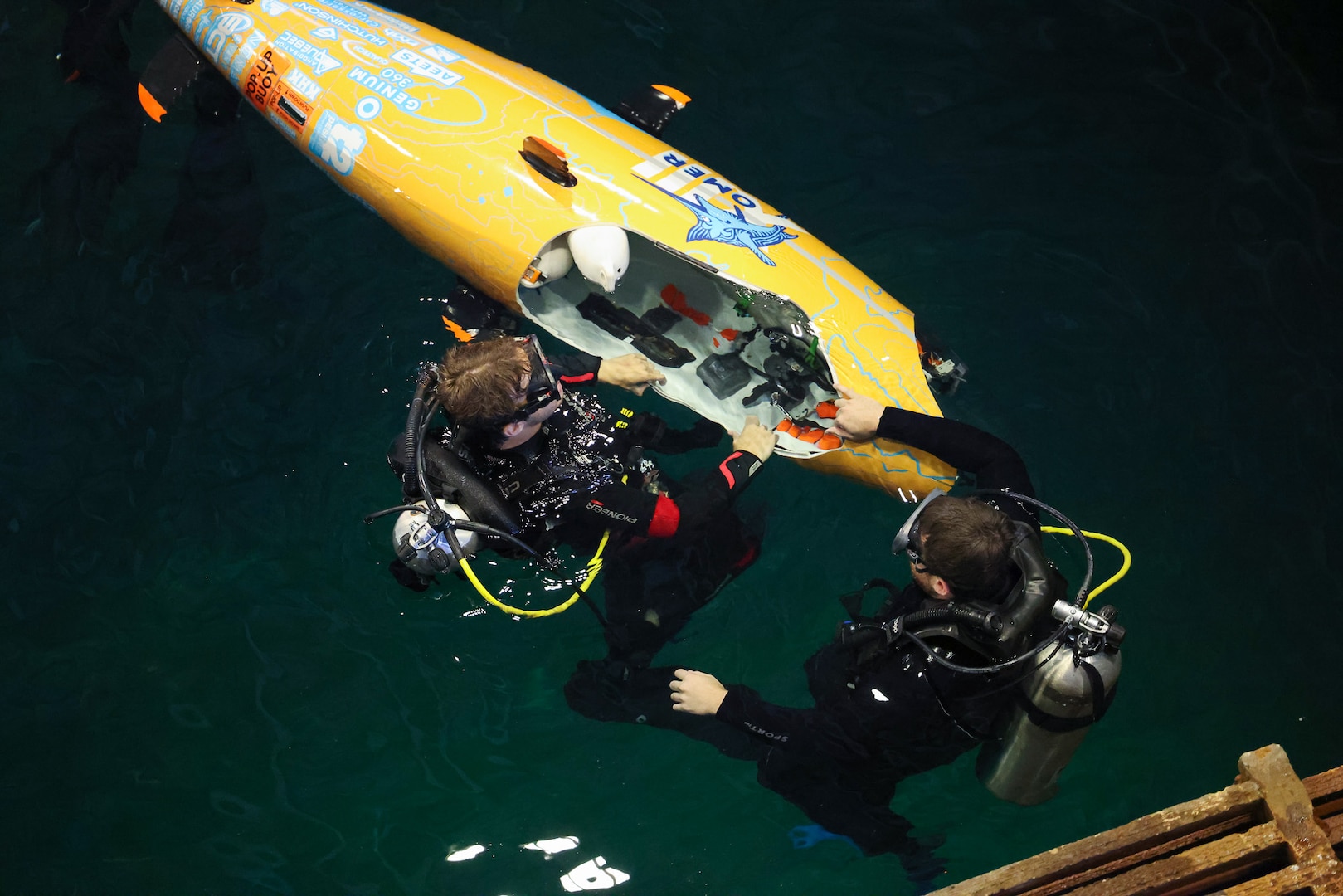 Team OMER works on their sub inside the David Taylor Model Basin at NSWC Carderock in Bethesda, Md.