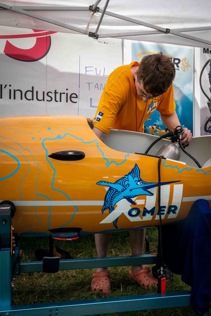 Team OMER from École de Technologie Supérieur (ETS) in Québec, Canada set a new world record for fastest speed in a single-person propellor submarine (7.682 knots) at the International Human-powered Submarines Races hosted biennially at NSWC Carderock Division.  They also took home the Maritime Technology Alliance Overall Performance Award, the Absolute Speed Award, and the Best Spirit of the Races Award.