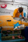 Team OMER from École de Technologie Supérieur (ETS) in Québec, Canada set a new world record for fastest speed in a single-person propellor submarine (7.682 knots) at the International Human-powered Submarines Races hosted biennially at NSWC Carderock Division.  They also took home the Maritime Technology Alliance Overall Performance Award, the Absolute Speed Award, and the Best Spirit of the Races Award.