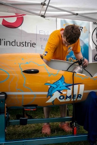 Team OMER from École de Technologie Supérieur (ETS) in Québec, Canada set a new world record for fastest speed in a single-person propellor submarine (7.682 knots) at the International Human-powered Submarines Races hosted biennially at NSWC Carderock Division.  They also took home the Maritime Technology Alliance Overall Performance Award, the Absolute Speed Award, and the Best Spirit of the Races Award.