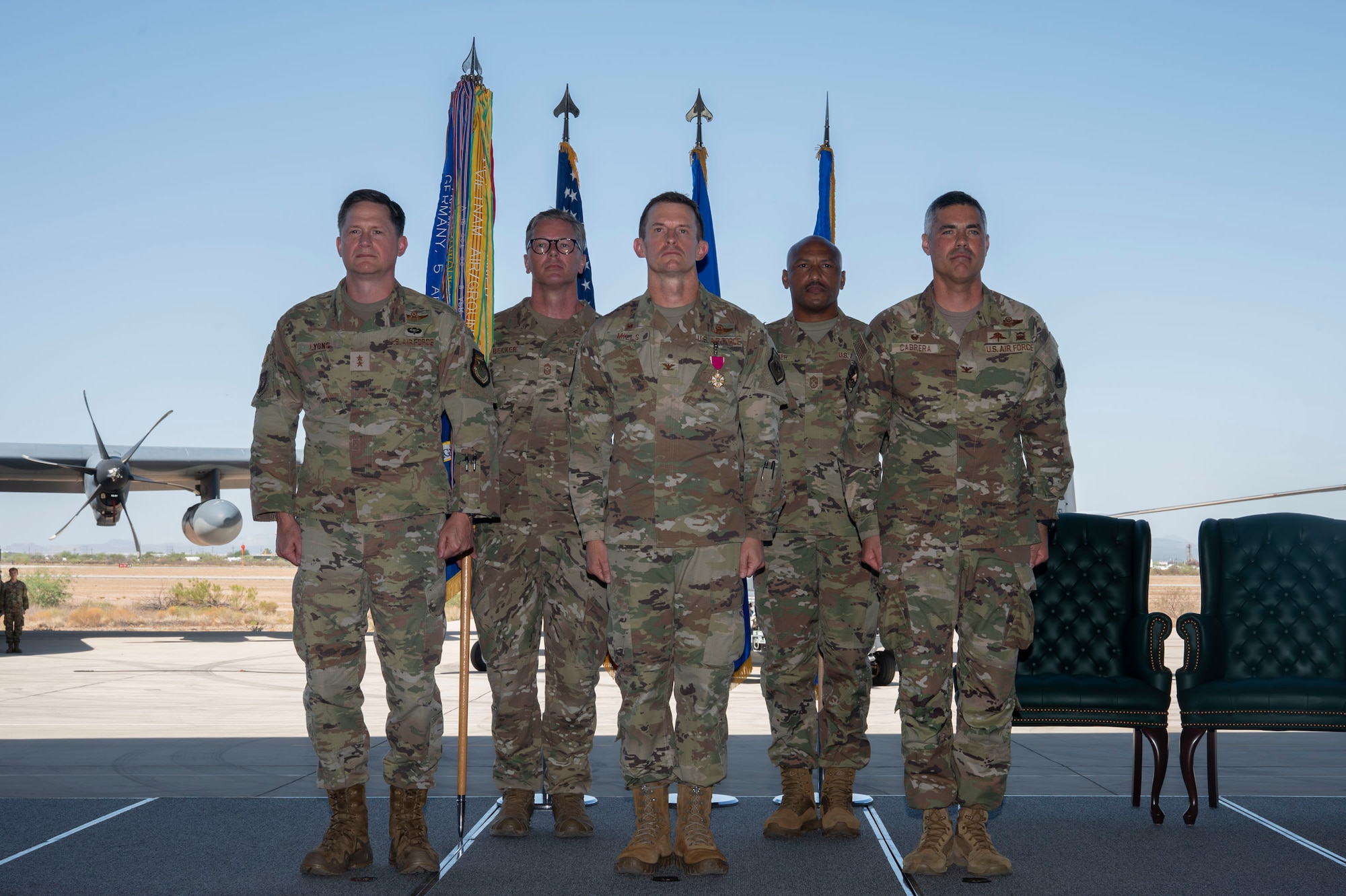 The 355th Wing outgoing and incoming command teams stand at attention during the 355th Wing Change of Command ceremony at Davis-Monthan Air Force Base, Arizona, July 10, 2025. The 355th Wing is charged with deploying, employing and sustaining combat search and rescue capabilities in support of global operations. (U.S. Air Force photo by Airman Samantha Melecio)