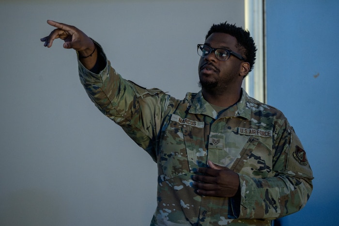U.S. Air Force Staff Sgt. Darian Marcus, 35th Security Forces Squadron defender, speaks about base policy during an arrival briefing for exercise Resolute Force Pacific (REFORPAC) 2025 at Misawa Air Base, Japan, July 10, 2025.