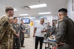 Executive chef Geronimo Lopez of Hotel Emma gestures as he talks to students from the Executive Mission Aviator course