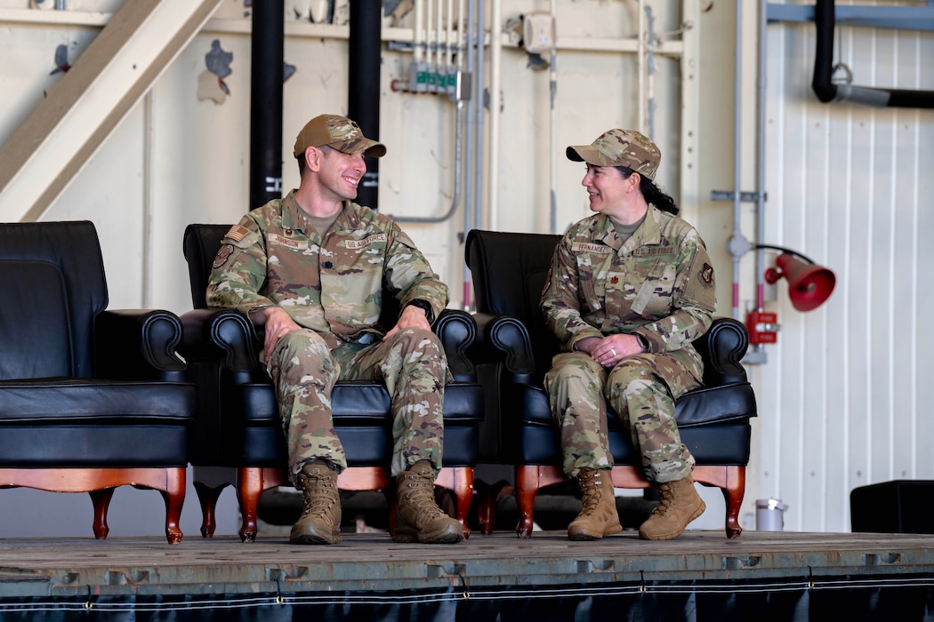 U.S. Air Force Col. Brian Johnson, outgoing 8th Healthcare Operations Squadron outgoing commander, and U.S. Air Force Maj. Irene Fernandez, 8th Healthcare Operations Squadron incoming commander share a laugh