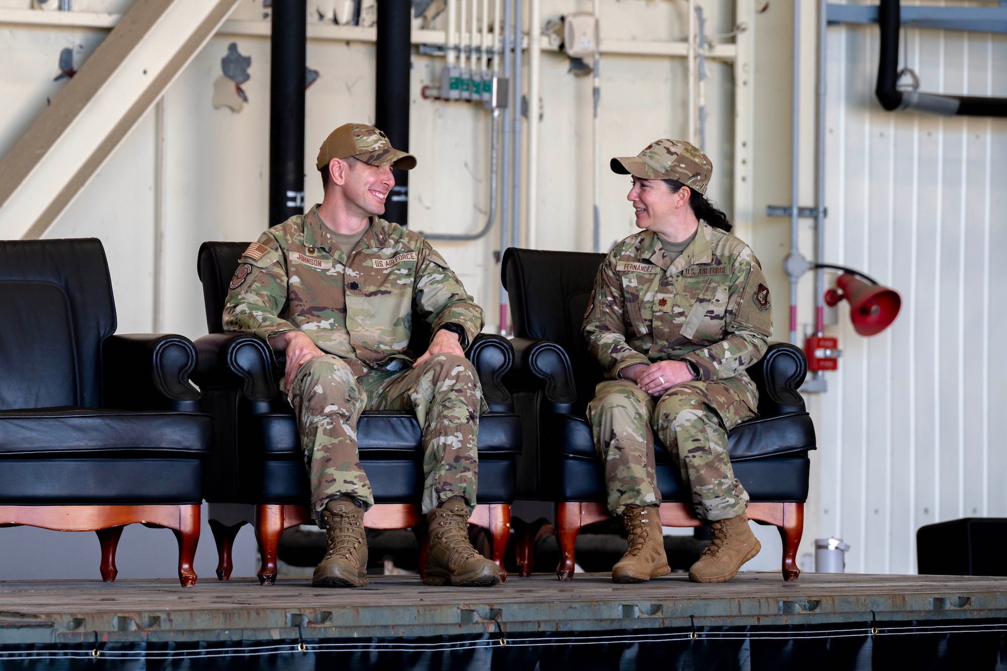 U.S. Air Force Col. Brian Johnson, outgoing 8th Healthcare Operations Squadron outgoing commander, and U.S. Air Force Maj. Irene Fernandez, 8th Healthcare Operations Squadron incoming commander share a laugh