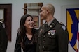 Newly promoted Maj. Alec Velasco enjoys the moment with his wife, Stella, at his promotion ceremony in December of 2023. Velasco is now the executive officer for Army Field Support Battalion-Germany, and Stella is a staff employee at the Netzaberg Youth Center in Grafenwoehr, Germany, where they live. (U.S. Army courtesy photo)
