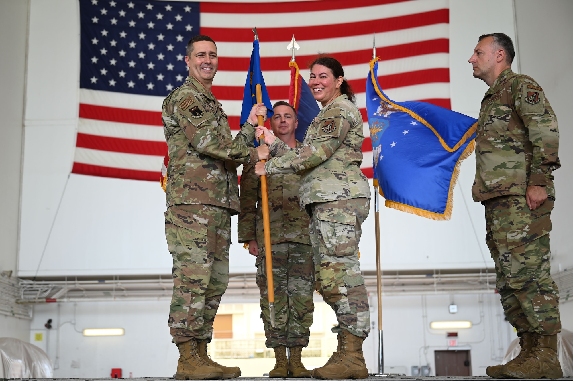 Photo of an outgoing commander passing a guidon during a change of command ceremony