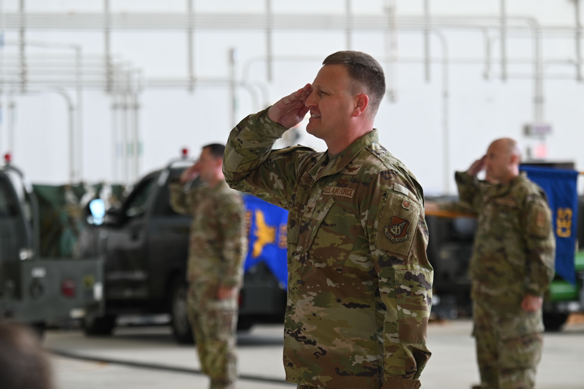 Photo of a deputy commander saluting during a change of command ceremony