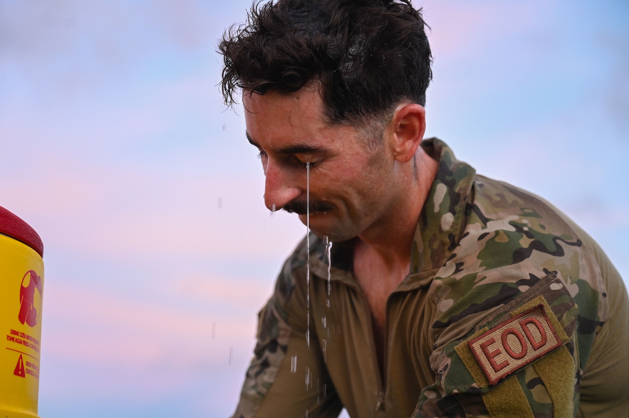 Photo of an Airman cooling off after a Norwegian Foot March