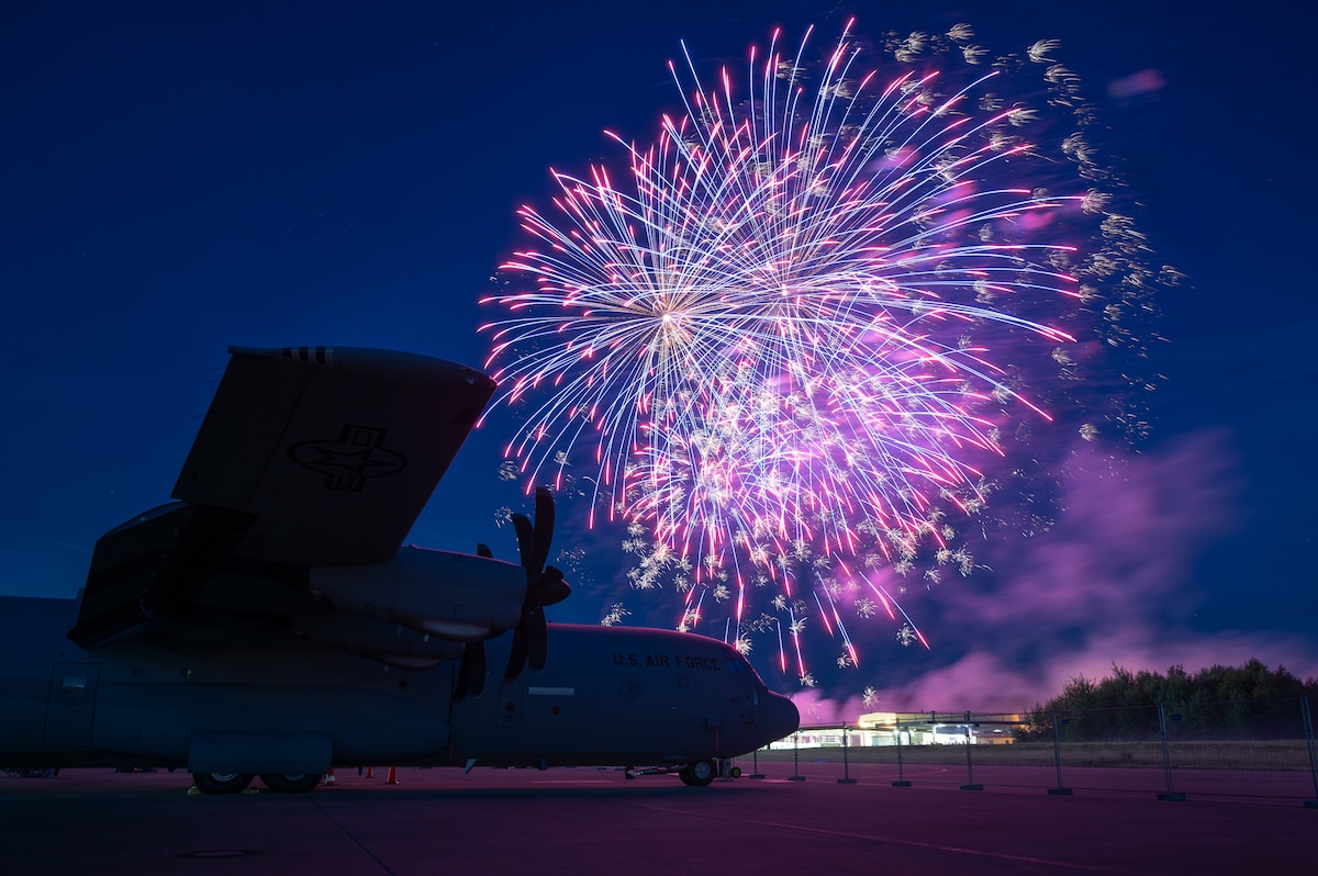A U.S. Air Force C-130J Super Hercules sits idle during a fireworks show at Ramstein Air Base, Germany, July 4, 2025. The two-day Independence Day festival also featured carnival rides, games, food vendors and live musical entertainment. (U.S. Air Force photo by Senior Airman Brenden Beezley)