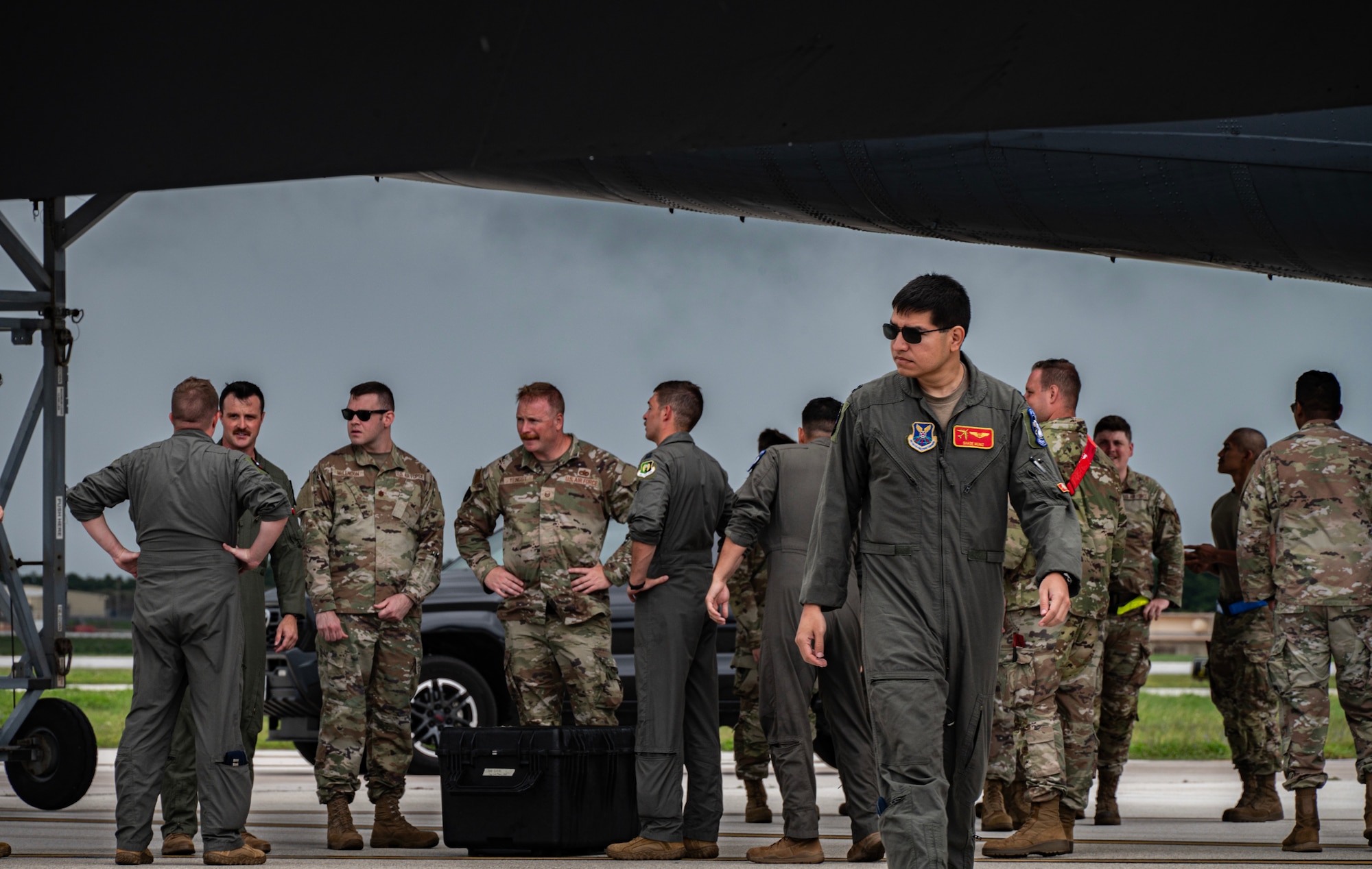 U.S. Air Force Airmen assigned to the 5th Bomb Wing, Minot Air Force Base, North Dakota, greet new arrivals supporting a Bomber Task Force mission at Andersen Air Force Base, Guam, July 7, 2025. These missions deter adversaries, assure allies and partners, strengthen interoperability, and maintain readiness and global strike capability. (U.S. Air Force photo by Senior Airman Alyssa Bankston)