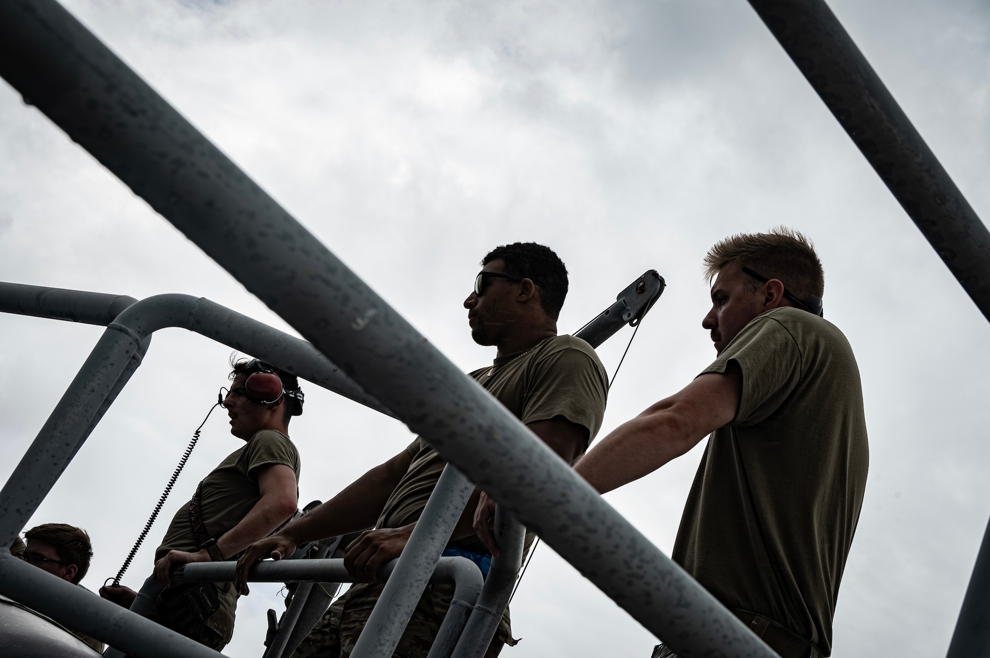 U.S. Air Force crew chiefs assigned to the 23rd Expeditionary Bomber Generation Squadron, Minot Air Force Base, North Dakota, observe post-flight maintenance on a USAF B-52H Stratofortress after a Bomber Task Force mission at Andersen Air Force Base, Guam, July 7, 2025. The BTF missions enable crews to maintain a high state of readiness, proficiency and validate the always-ready global strike capability. (U.S. Air Force photo by Senior Airman Alyssa Bankston)
