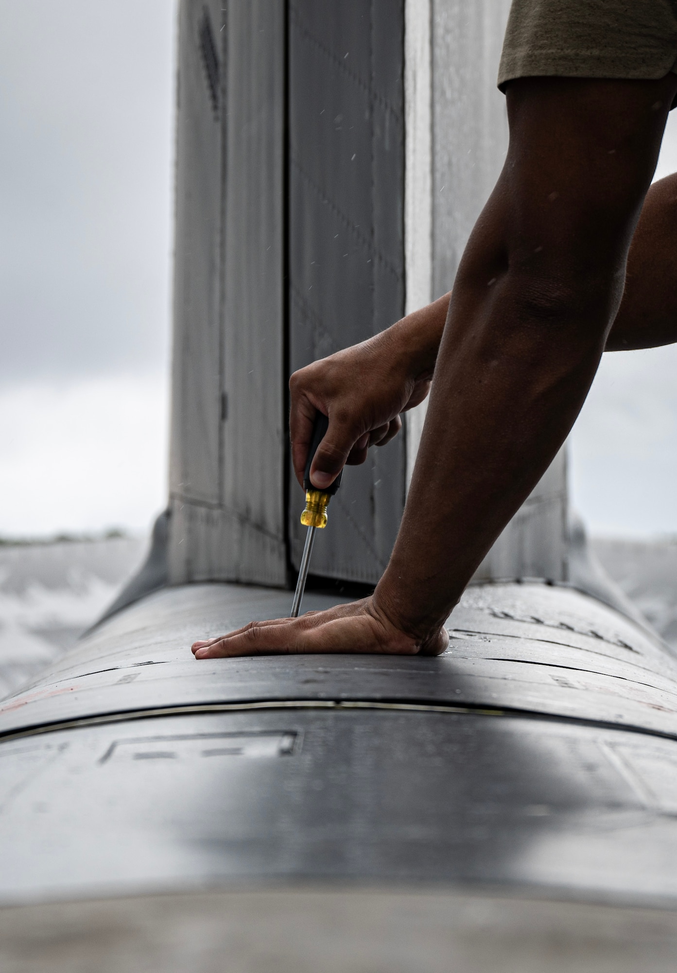 U.S. Air Force Staff Sgt. Jovan Marrero, 23rd Expeditionary Bomber Generation Squadron crew chief, performs post-flight maintenance on a USAF B-52H Stratofortress after a Bomber Task Force mission at Andersen Air Force Base, Guam, July 7, 2025. The BTF missions enable crews to maintain a high state of readiness, proficiency, and validate the always-ready global strike capability. (U.S. Air Force photo by Senior Airman Alyssa Bankston)