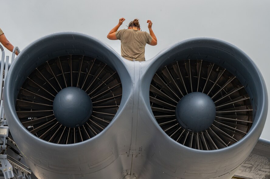 U.S. Air Force Senior Airman Bethany Jones, 23rd Expeditionary Bomber Generation Squadron assistant dedicated crew chief, performs post-flight maintenance on a USAF B-52H Stratofortress after a Bomber Task Force mission at Andersen Air Force Base, Guam, July 7, 2025. The U.S. demonstrates commitment to allies and partners, including those in the Indo-Pacific, through the global employment of military forces, such as regular BTF deployments. (U.S. Air Force photo by Airman 1st Class Vincent Padilla)