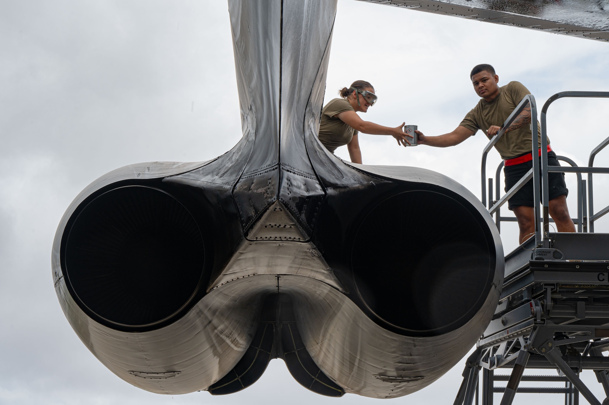 U.S. Air Force Senior Airman Bethany Jones (left), and USAF Staff Sgt. Peter James Olandez (right), 23rd Expeditionary Bomber Generation Squadron crew chiefs, perform post-flight maintenance on a USAF B-52H Stratofortress after a Bomber Task Force mission at Andersen Air Force Base, Guam, July 7, 2025. The U.S. demonstrates commitment to allies and partners, including those in the Indo-Pacific, through the global employment of military forces, such as regular BTF deployments. (U.S. Air Force photo by Airman 1st Class Vincent Padilla)