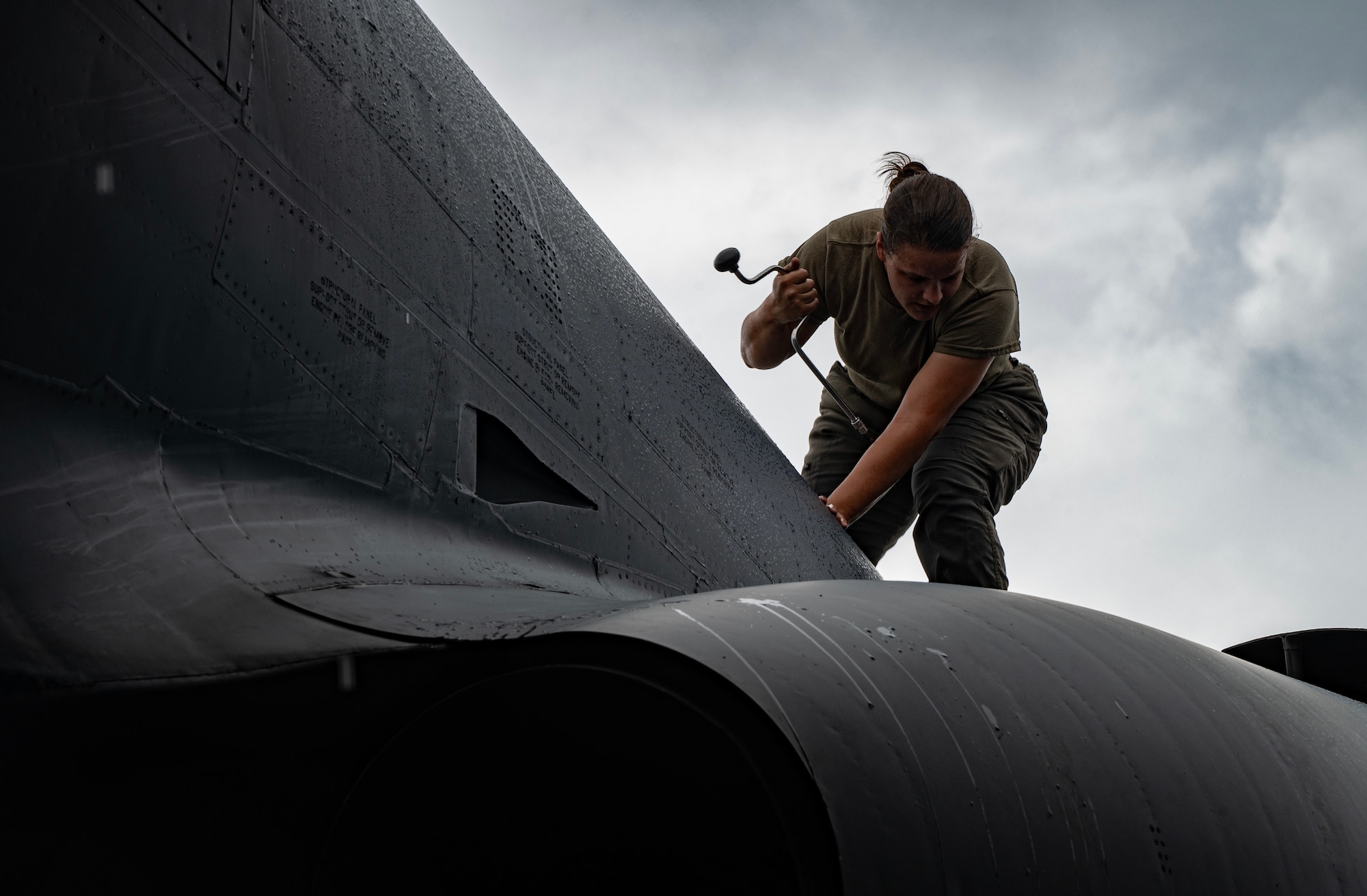 U.S. Air Force Senior Airman Bethany Jones, 23rd Expeditionary Bomber Generation Squadron assistant dedicated crew chief, performs post-flight maintenance on a B-52H Stratofortress after a Bomber Task Force mission at Andersen Air Force Base, Guam, July 7, 2025. The BTF missions enhance operational readiness and provide the training necessary to respond to any potential crisis or challenge in the Indo-Pacific. (U.S. Air Force photo by Senior Airman Alyssa Bankston)