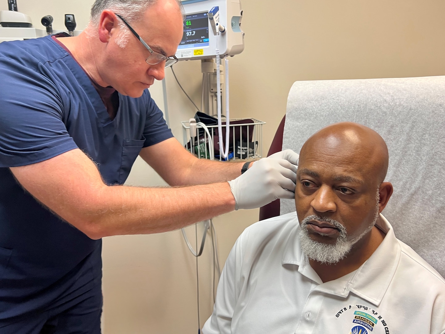Patient receiving battlefield acupuncture from a BJACH provider.