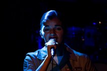 U.S. Marine Corps Sgt. Shelby Petersen, the lead vocalist of the Quantico Marine Rock Band, assigned to Special Purpose Marine Air-Ground Task Force-250, sings at Rookies RocHaus in West Dundee, Illinois, as part of Marine Week Chicago, July 10, 2025. The Quantico Marine Rock Band performed as a feature event to celebrate the 250th anniversary of the U.S. Marine Corps. Throughout the year, Marines across the globe will celebrate the 250th birthday of the Corps, commemorating service, sacrifice, and priding themselves on living ‘Semper Fidelis’ or ‘Always Faithful’ to their nation and to each other. (U.S. Marine Corps photo by Lance Cpl. Elijua Guel)