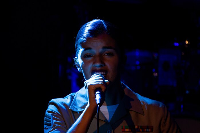 U.S. Marine Corps Sgt. Shelby Petersen, the lead vocalist of the Quantico Marine Rock Band, assigned to Special Purpose Marine Air-Ground Task Force-250, sings at Rookies RocHaus in West Dundee, Illinois, as part of Marine Week Chicago, July 10, 2025. The Quantico Marine Rock Band performed as a feature event to celebrate the 250th anniversary of the U.S. Marine Corps. Throughout the year, Marines across the globe will celebrate the 250th birthday of the Corps, commemorating service, sacrifice, and priding themselves on living ‘Semper Fidelis’ or ‘Always Faithful’ to their nation and to each other. (U.S. Marine Corps photo by Lance Cpl. Elijua Guel)