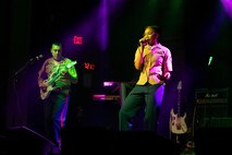 U.S. Marine Corps Lance Cpl. Travia Jackson, a vocalist in the Quantico Marine Rock Band, right, and Gunnery Sgt. Eduardo Espinosa, the guitar instrumentalist and unit leader of the Quantico Marine Rock Band, both assigned to Special Purpose Marine Air-Ground Task Force-250, perform at Rookies RocHaus in West Dundee, Illinois, as part of Marine Week Chicago 2025, July 10, 2025. The Quantico Marine Rock Band performed as a feature event to celebrate the upcoming 250th anniversary of the U.S. Marine Corps. Throughout 2025, Marines across the globe will celebrate the 250th birthday of the Corps, commemorating service, sacrifice, and priding themselves on living ‘Semper Fidelis’ or ‘Always Faithful’ to their nation and to each other. (U.S. Marine Corps photo by Lance Cpl. Elijua Guel)