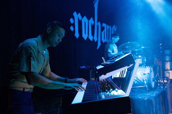 U.S. Marine Corps Cpl. Tang Hseih, a keyboard player of the Quantico Marine Rock Band, assigned to Special Purpose Marine Air-Ground Task Force-250, performs at Rookies RocHaus in West Dundee, Illinois, as part of Marine Week Chicago 2025, July 10, 2025. The Quantico Marine Rock Band performed as a feature event to promote the 250th anniversary of the U.S. Marine Corps. Throughout 2025, Marines across the globe will celebrate the 250th birthday of the Corps, commemorating service, sacrifice, and priding themselves on living ‘Semper Fidelis’ or ‘Always Faithful’ to their nation and to each other. (U.S. Marine Corps photo by Lance Cpl. Elijua Guel)