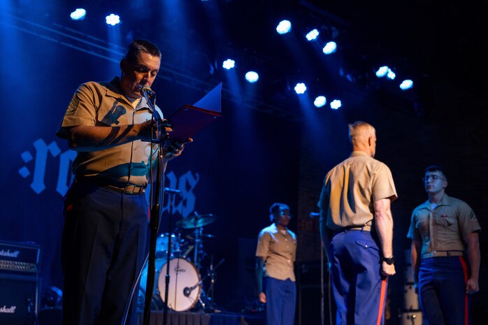 U.S. Marines assigned to Special Purpose Marine Air-Ground Task Force-250, stand at attention during an award and reenlistment ceremony for Cpl. William Pfaff at Rookies RocHaus in West Dundee, Illinois, as part of Marine Week Chicago, July 10, 2025. The awards and reenlistment ceremony highlighted Pfaff's accomplishments and decision to continue to serve, represent, and carry the U.S. Marine Corps’ core values of honor, courage and commitment. Throughout 2025, Marines across the globe will celebrate the 250th birthday of the Corps, commemorating service, sacrifice, and priding themselves on living ‘Semper Fidelis’ or ‘Always Faithful’ to their nation and to each other. (U.S. Marine Corps photo by Lance Cpl. Elijua Guel)