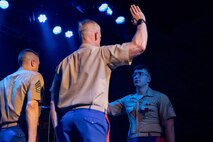 U.S. Marine Corps Cpl. William Pfaff, the bass player of the Quantico Marine Rock Band, assigned to Special Purpose Marine Air-Ground Task Force-250, reenlists at Rookies RocHaus in West Dundee, Illinois, as part of Marine Week Chicago 2025, July 10, 2025. The reenlistment ceremony highlighted Pfaff's accomplishments and decision to continue to serve, represent, and carry the U.S. Marine Corps’ core values of honor, courage and commitment. Throughout 2025, Marines across the globe will celebrate the 250th birthday of the Corps, commemorating service, sacrifice, and priding themselves on living ‘Semper Fidelis’ or ‘Always Faithful’ to their nation and to each other. (U.S. Marine Corps photo by Lance Cpl. Elijua Guel)