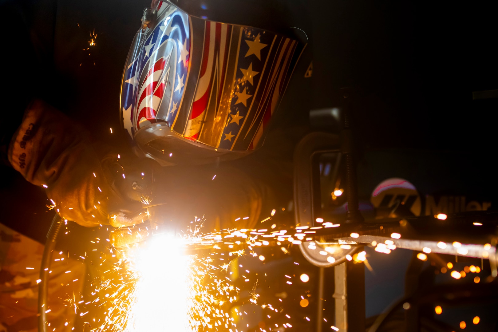 Airman using a plasma cutter
