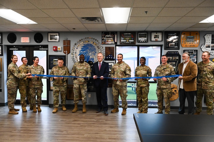 Team Charleston leaders participate in a ribbon cutting ceremony to commemorate the Professional Development Center grand opening at Joint Base Charleston.