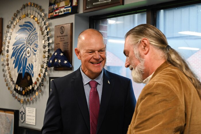 Retired Chief Master Sgt. of the Air Force James A. Roy addresses the expansion of educational resources during the Professional Development Center grand opening at Joint Base Charleston.
