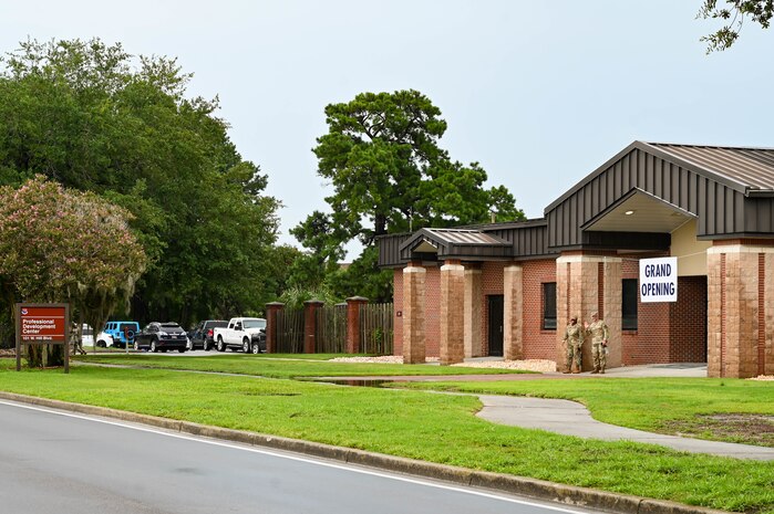 A ‘Grand Opening’ sign is placed above the entrance of the Professional Development Center building during the PDC grand opening at Joint Base Charleston.