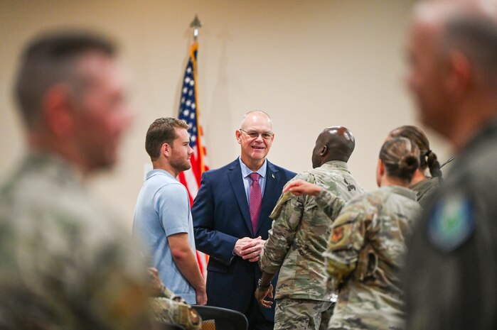 Retired Chief Master Sgt. of the Air Force James A. Roy speaks with U.S. Air Force Col. Adeleke Ekundayo, 628th Mission Support Group commander, during the Professional Development Center grand opening at Joint Base Charleston.