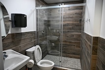 Restroom with walk-in shower and toilet/sink