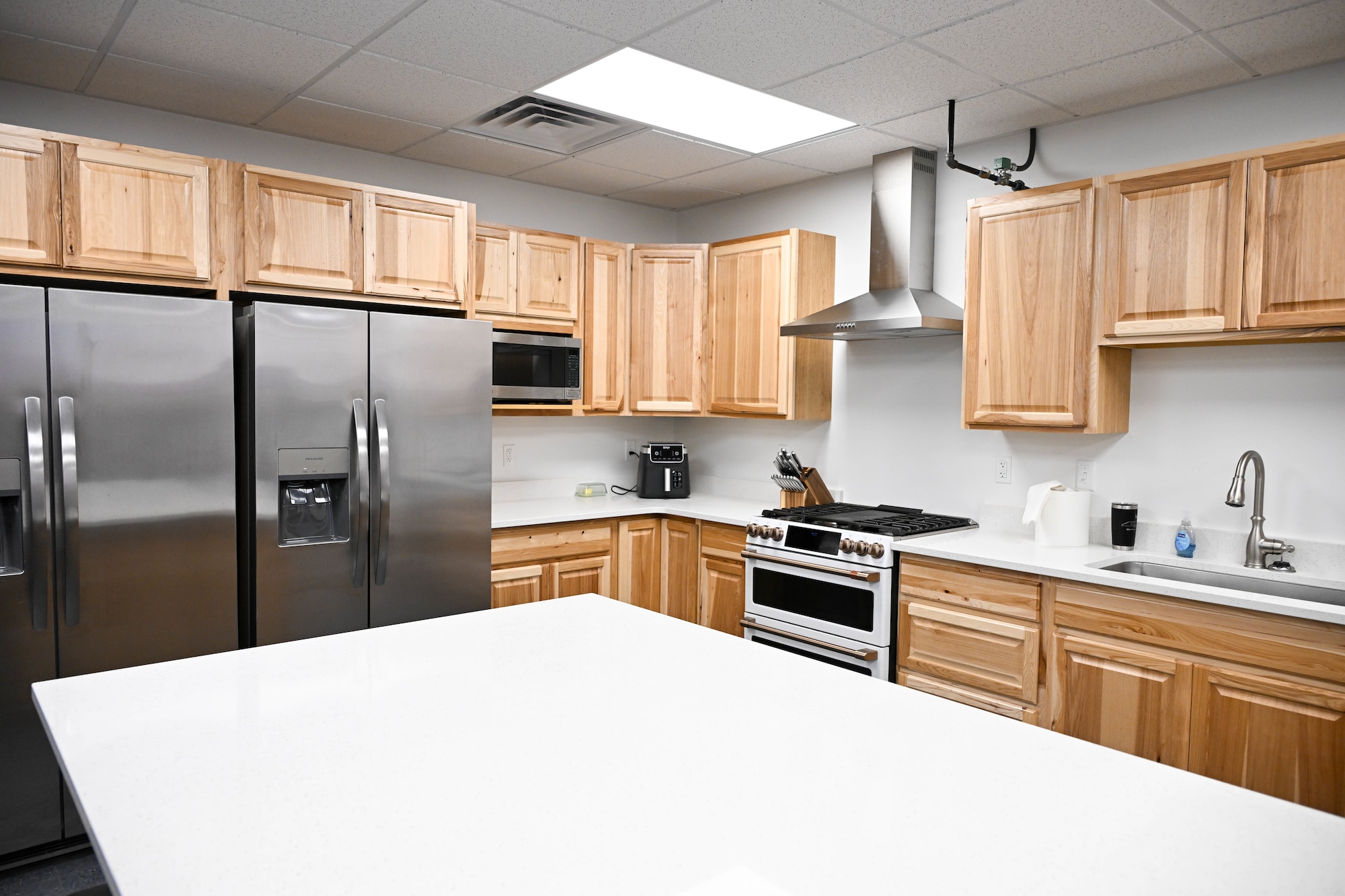 Kitchen with 2 refrigerators and a island