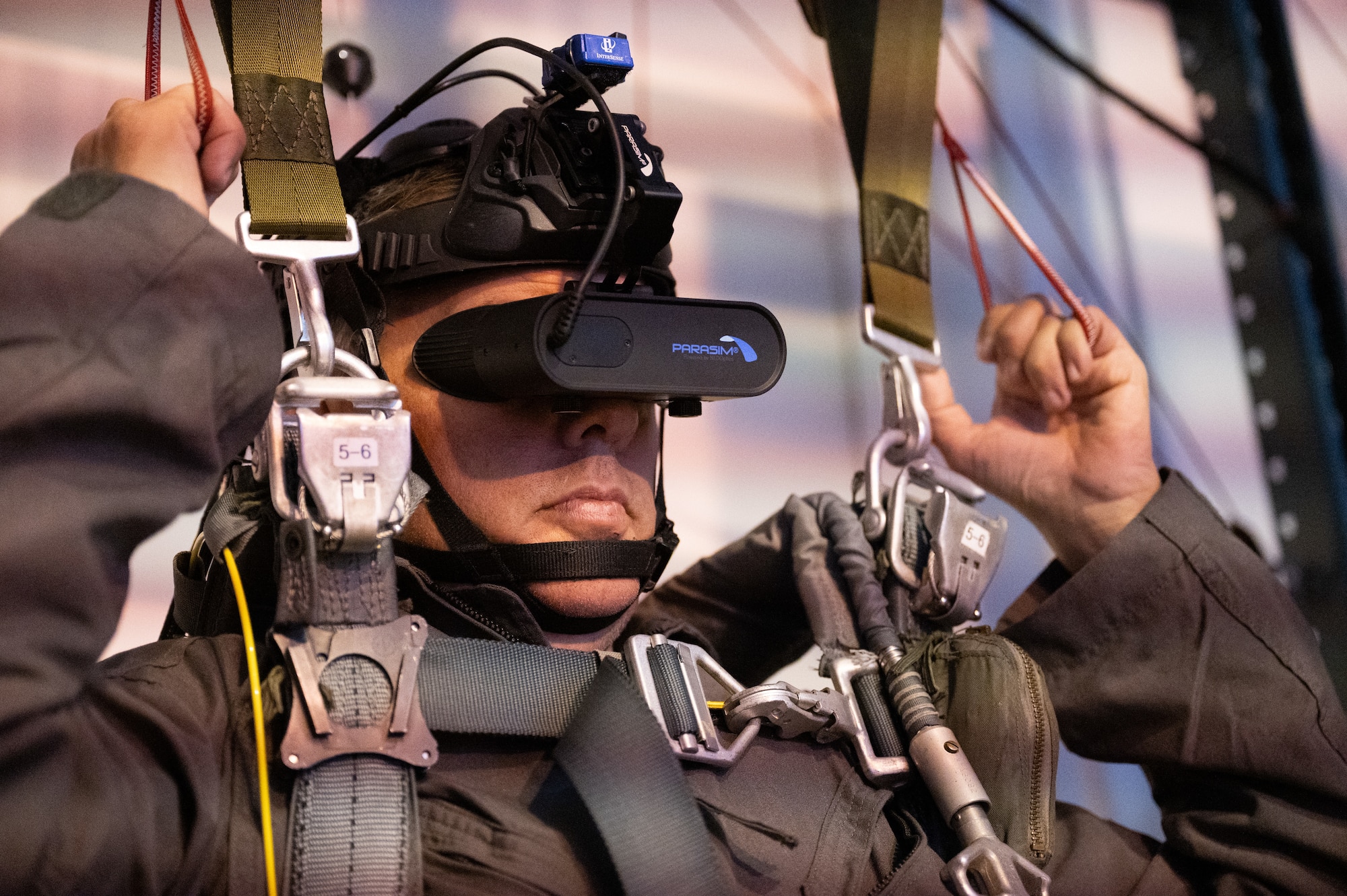 North Dakota Gov. Kelly Armstrong practices parachuting procedures in a virtual reality simulator at Minot Air Force Base, North Dakota, June 30, 2025. In preparation for his orientation flight, Armstrong was instructed in emergency procedures, such as how to eject his seat and parachute safely. (U.S. Air Force photo by Senior Airman Kendra A. Ransum)