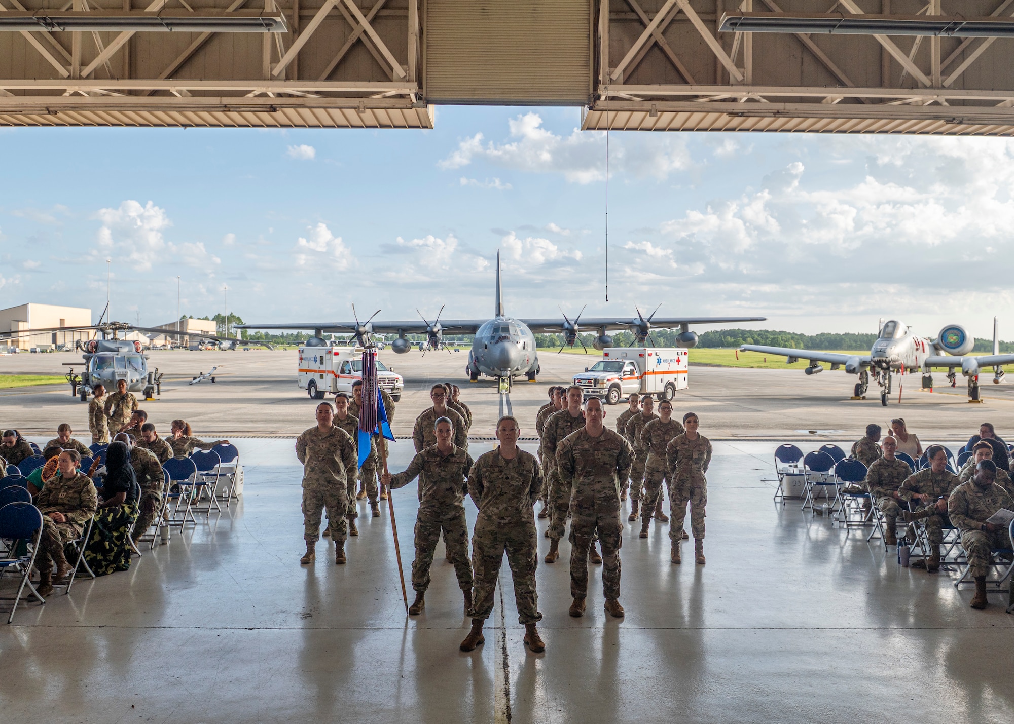 U.S. Air Force Airmen assigned to the 23rd Medical Group stand in formation during a change of command ceremony at Moody Air Force Base, Georgia, July 11, 2025. This tradition highlights the continuity of leadership and the enduring commitment to mission readiness. (U.S. Air Force photo by Senior Airman Leonid Soubbotine)