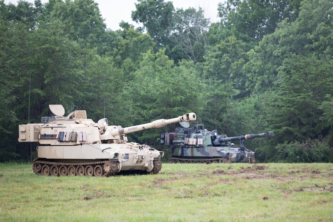 While waiting, the Soldiers reconfirm their positioning and conduct a dry-fire exercise