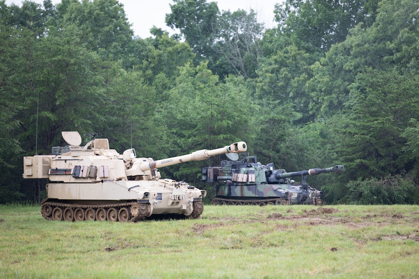 While waiting, the Soldiers reconfirm their positioning and conduct a dry-fire exercise