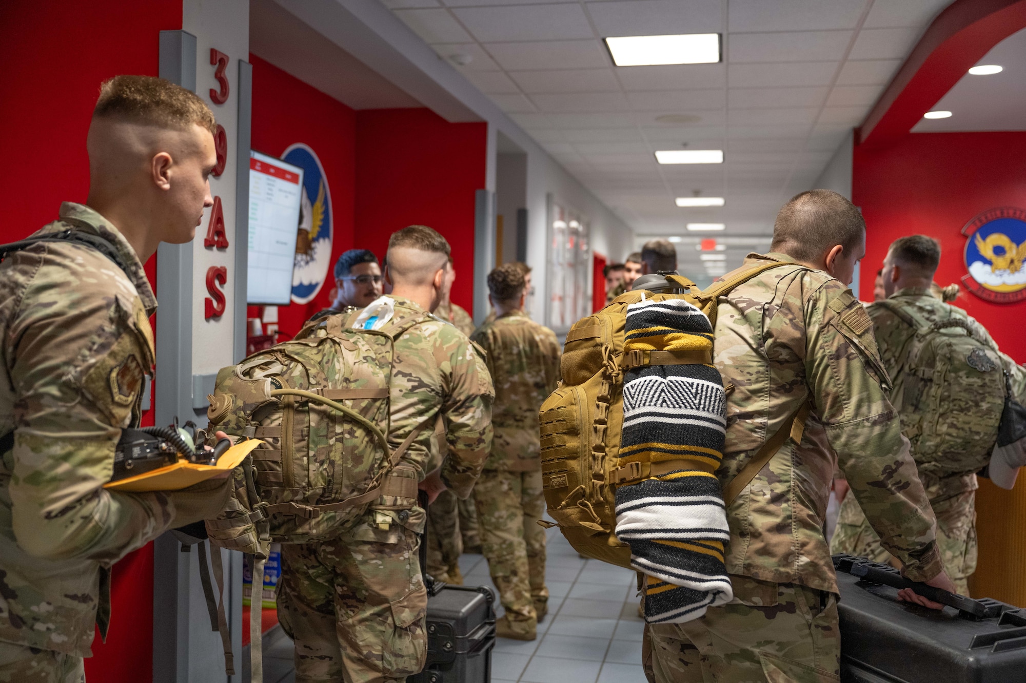U.S. Airmen from Dyess Air Force Base prepare to step onto the flight line before a Max Endurance Operation in support of the 2025 Department-Level Exercise series at Dyess AFB, Texas, July 8, 2025. Air Mobility Command’s rapid deployment into theater provides the global mobility required to enable the U.S. Air Force’s execution of the DLE series at speed and scale. The DLE series encompasses all branches of the Department of Defense, along with Allies and partners, employing more than 400 Joint and coalition aircraft and more than 12,000 members at more than 50 locations across 3,000 miles. (U.S. Air Force photo by Airman Caleb Schellenberg)