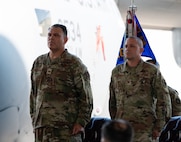 Two U.S. Air Force Colonels stand at attention during the assumption of command.