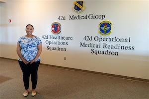 U.S. Air Force civilian employee Mrs. Emily Hightower poses for a picture at the 42nd Medical Group building at Maxwell Air Force Base, Alabama, July 2, 2025. Hightower, who serves as the director for patient’s access to care, was recognized as the 42nd Air Base Wing’s Crusader of the Month for June, 2025. (U.S. Air Force photo by Senior Airman Evan Porter)