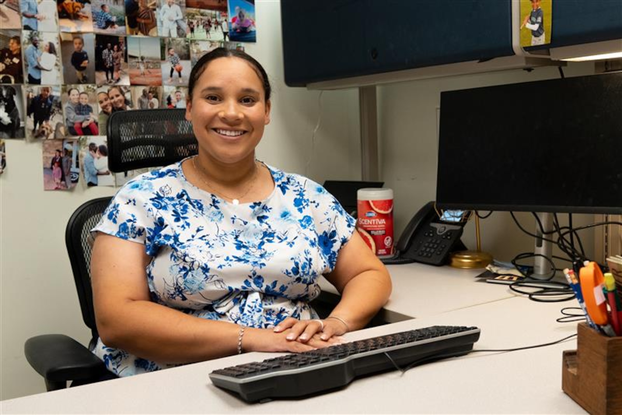 U.S. Air Force civilian employee Mrs. Emily Hightower poses for a picture in her office at the 42nd Medical Group building at Maxwell Air Force Base, Alabama, July 2, 2025. Hightower also serves as a U.S. Air Force Reserve captain with the 908th Aeromedical Staging Squadron. (U.S. Air Force photo by Senior Airman Evan Porter)