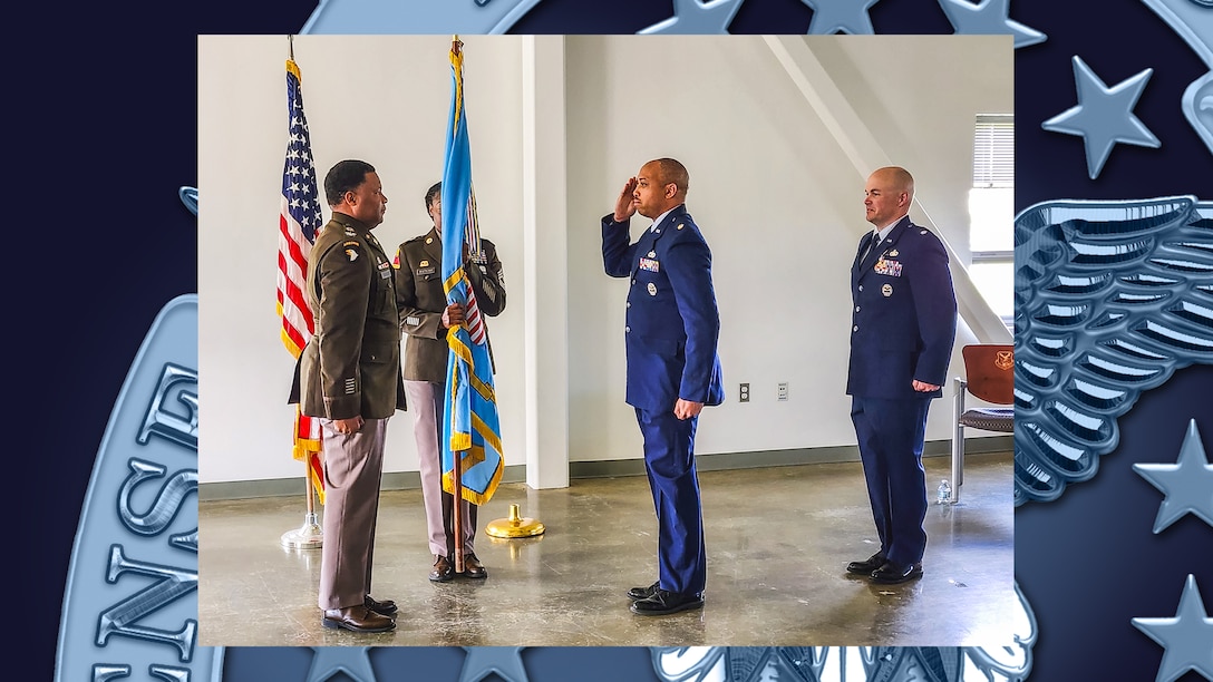 Person accepts command during ceremony.